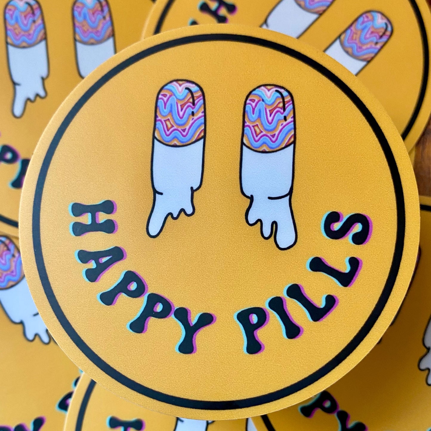 Trippy happy pills smiley face sticker with funky capsule eyes. 